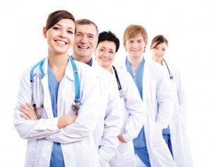 Happy doctors in hospital gowns